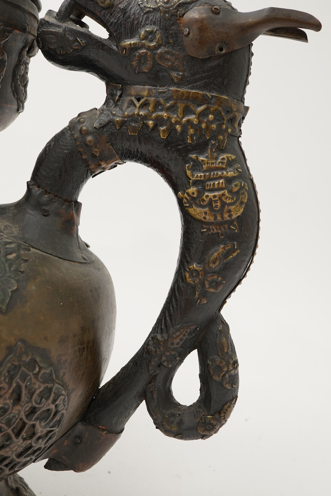 A large Tibetan repoussé brass and copper ewer, 19th century